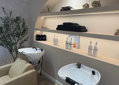 Elegant hair wash area at Millie @ Shade Harrogate in Harrogate, England, GB, featuring stylish modern decor.