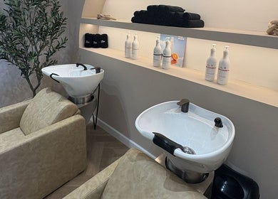 Elegant hair wash stations at Millie at Shade Harrogate, featuring plush chairs in Harrogate, England, GB.