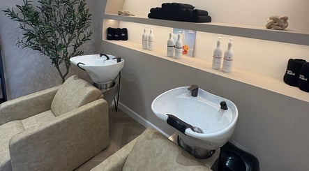 Elegant hair wash stations at Millie at Shade Harrogate, featuring plush chairs in Harrogate, England, GB.