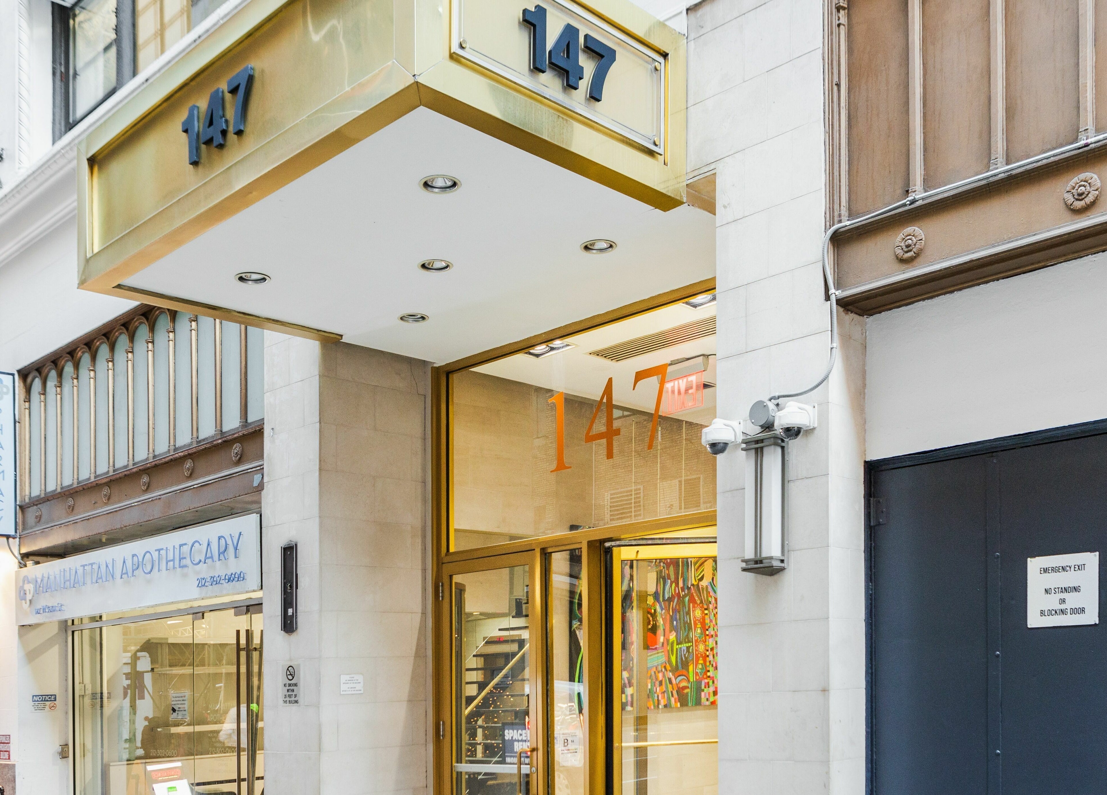 Entrance of V Lash Studio in New York, New York, US, with number 147 prominently displayed.