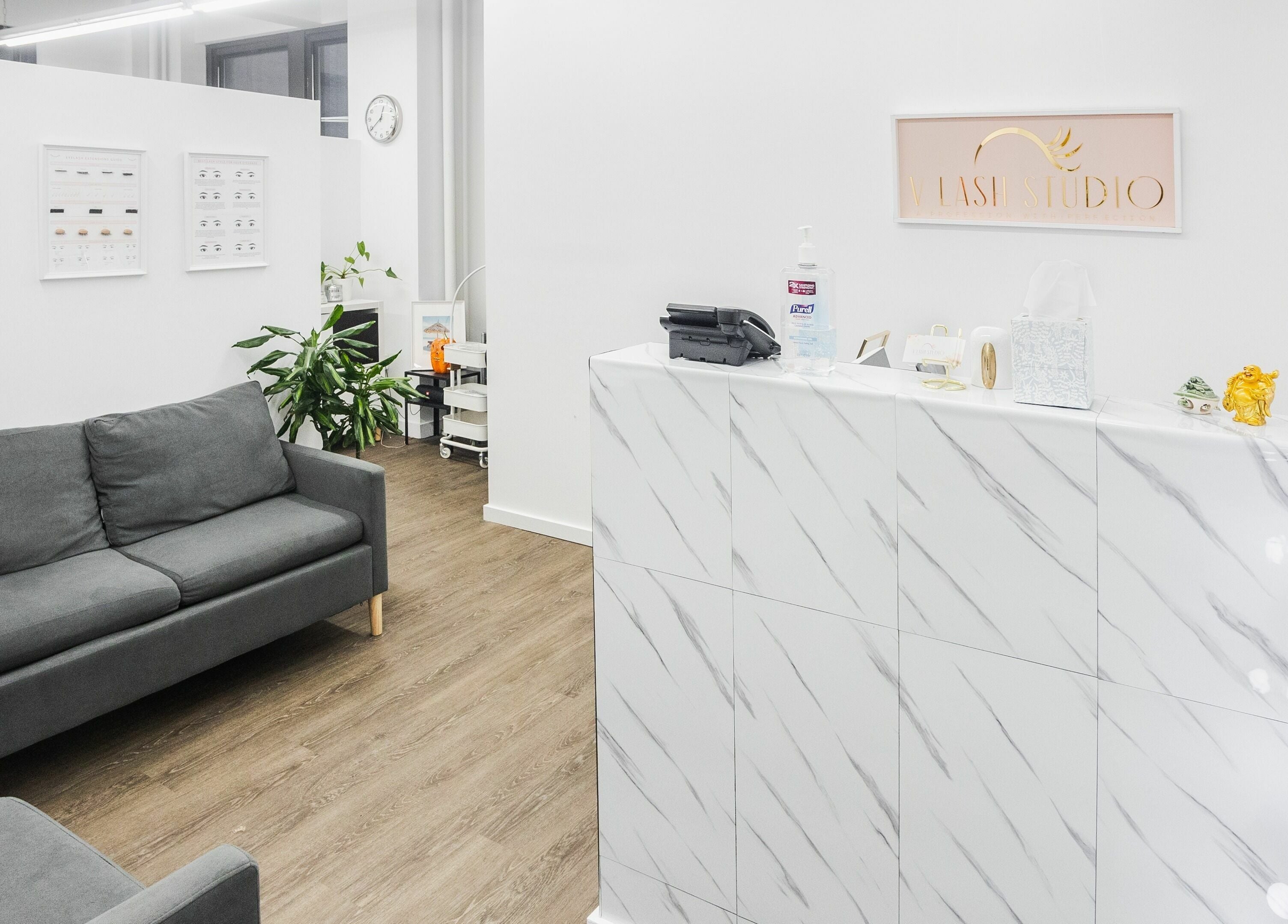 Elegant reception area at V Lash Studio, New York, New York, US with cozy seating and modern decor.