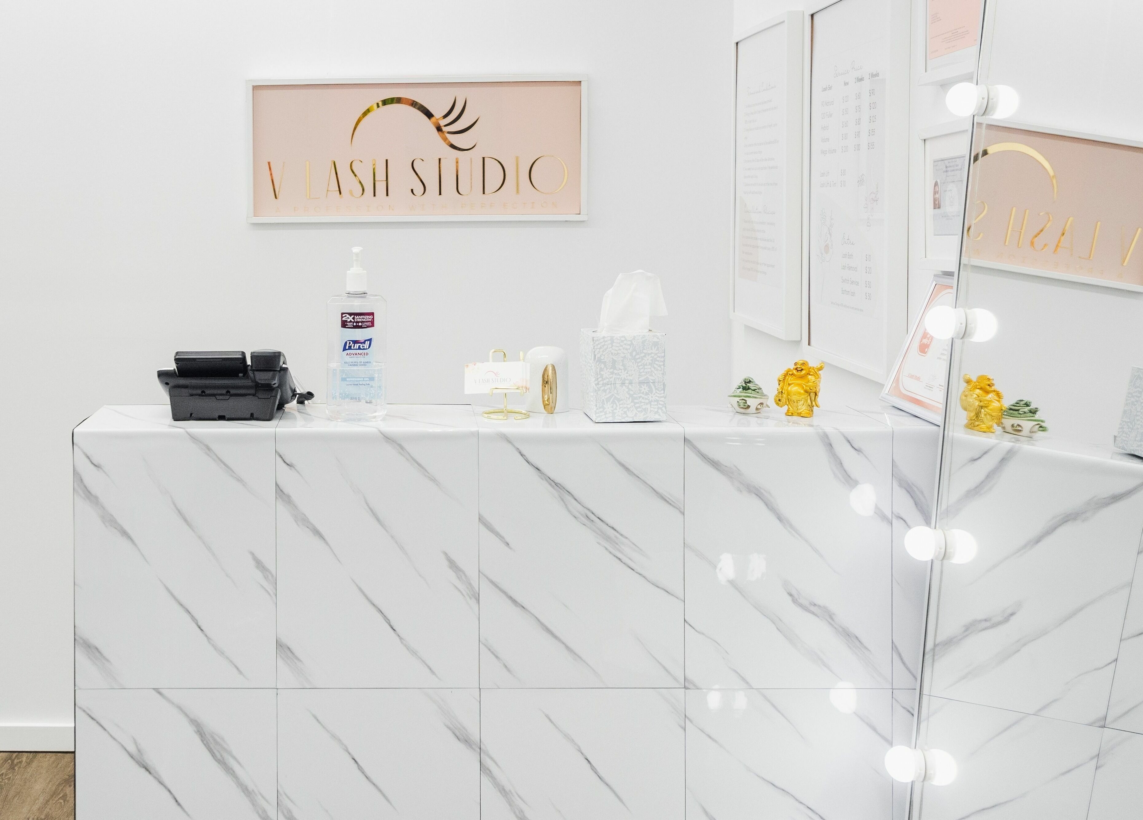 Elegant reception at V Lash Studio, New York, with marble surface and decorative accents.