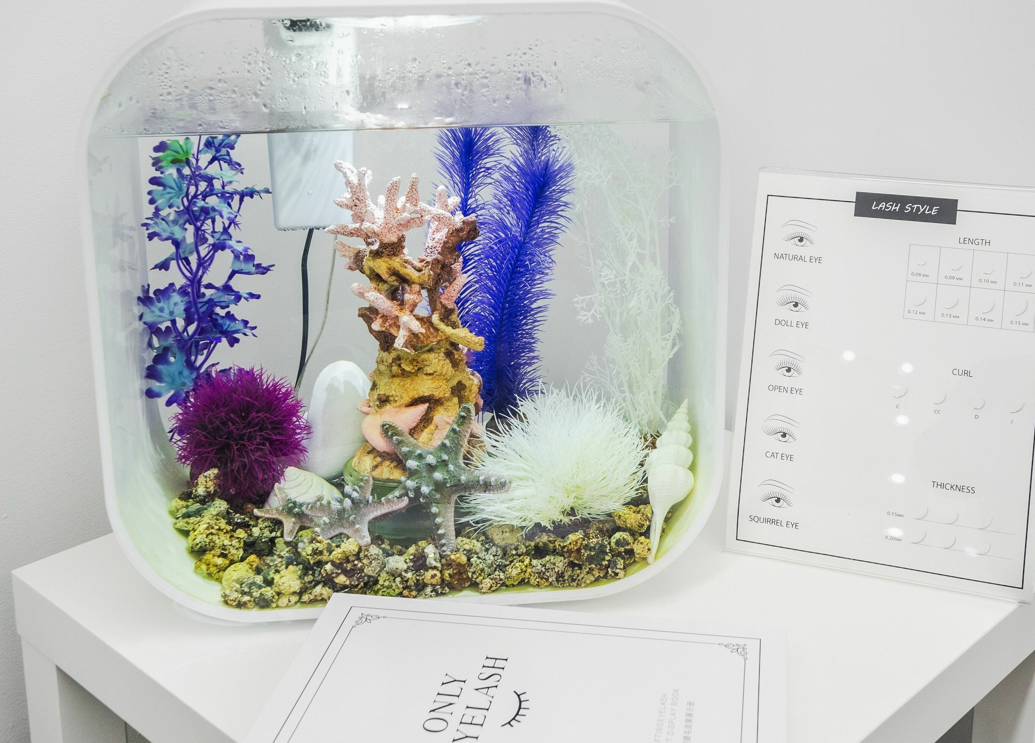 Stylish aquarium decor at V Lash Studio, New York, New York, US, enhancing a tranquil ambiance.