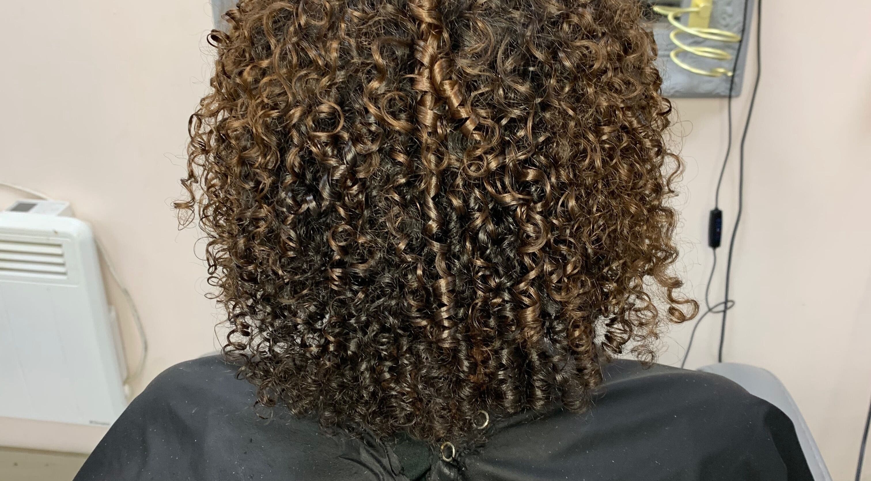 Beautifully styled curly hair at Manes by Morgan in Willenhall, England, GB.