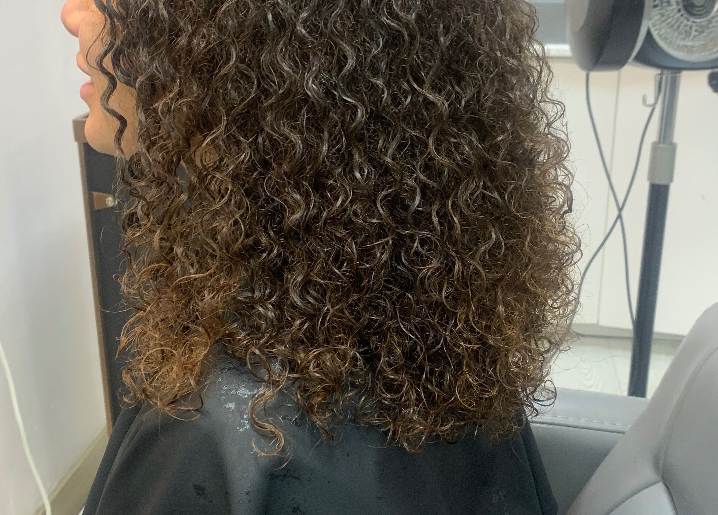 Styled curly hair at Manes by Morgan, Willenhall, England, GB. Experience lush curls and expert styling.