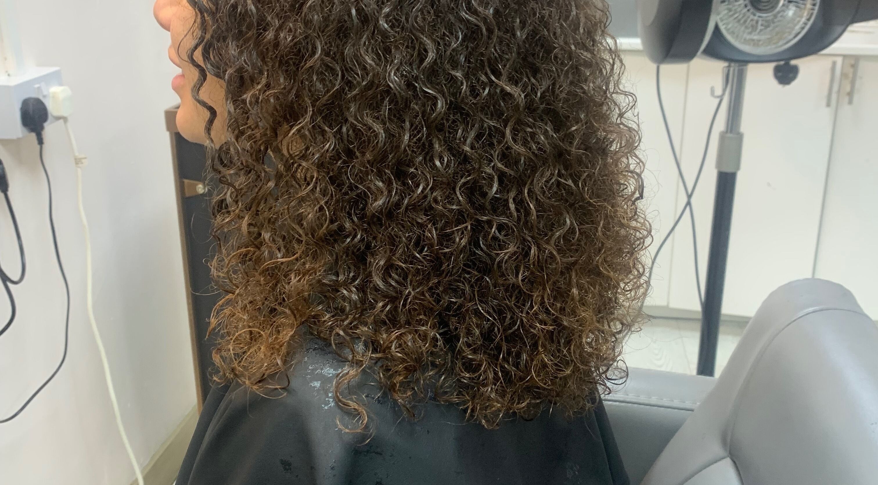 Styled curly hair at Manes by Morgan, Willenhall, England, GB. Experience lush curls and expert styling.
