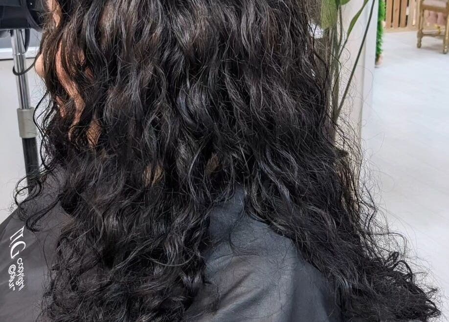 Beautiful curly hairstyle at Manes by Morgan, located in Willenhall, England, GB.