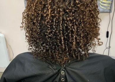 Beautiful curly hairstyle at Manes by Morgan, Birmingham, England, GB salon.
