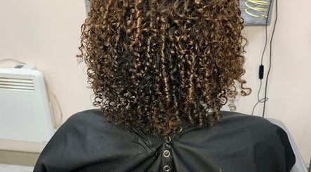Beautiful curly hairstyle at Manes by Morgan, Birmingham, England, GB salon.
