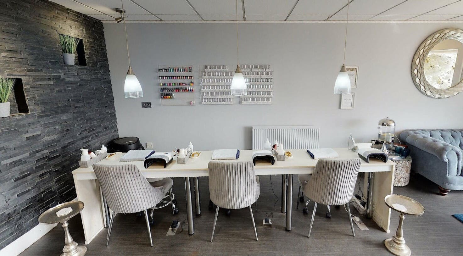 Chic nail station at The Venue Clinic Wallisdown in Bournemouth, England, GB, featuring plush seating and modern decor.