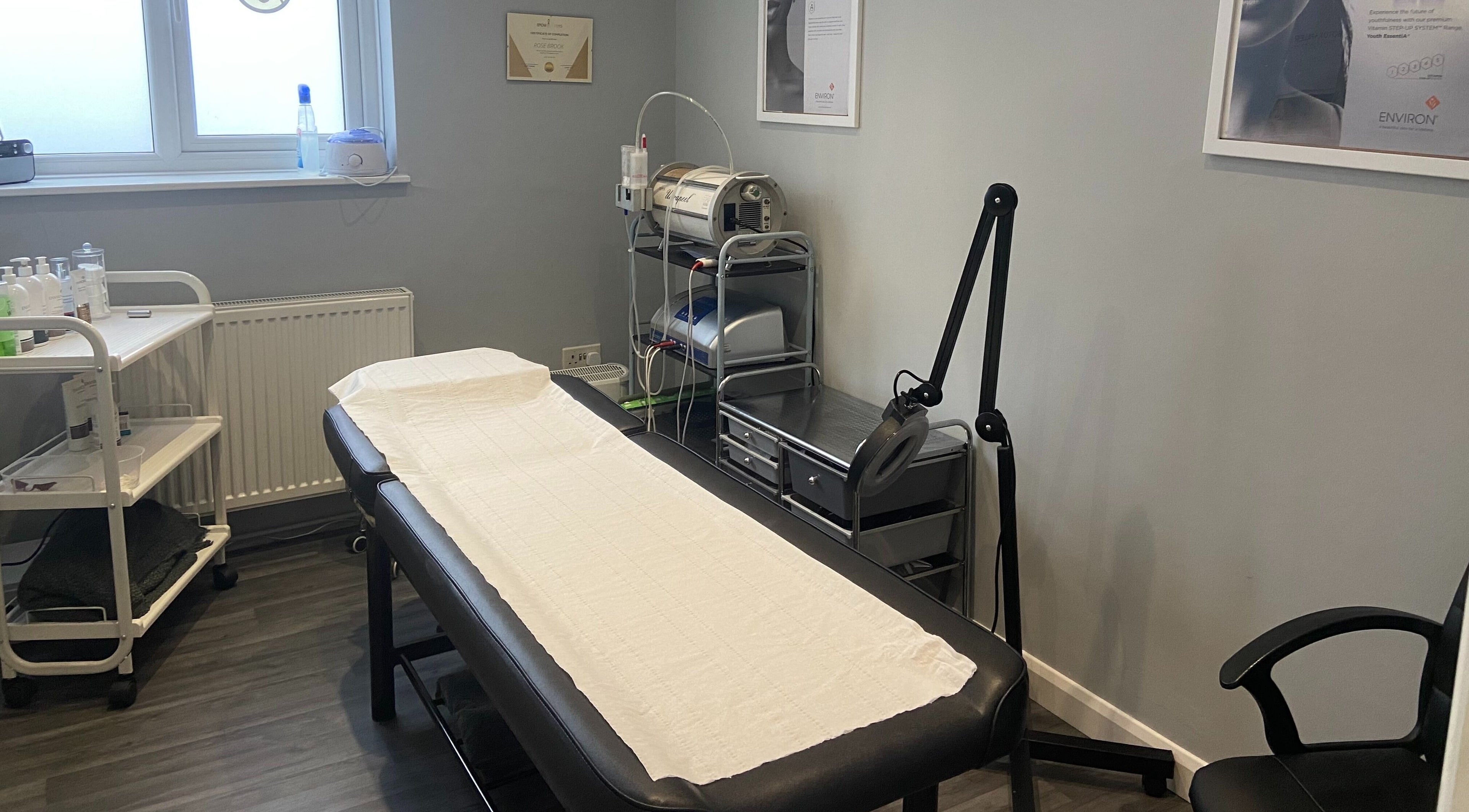 Revive Laser Clinic's serene treatment room in Snodland, England, GB, featuring a comfortable bed and modern equipment.