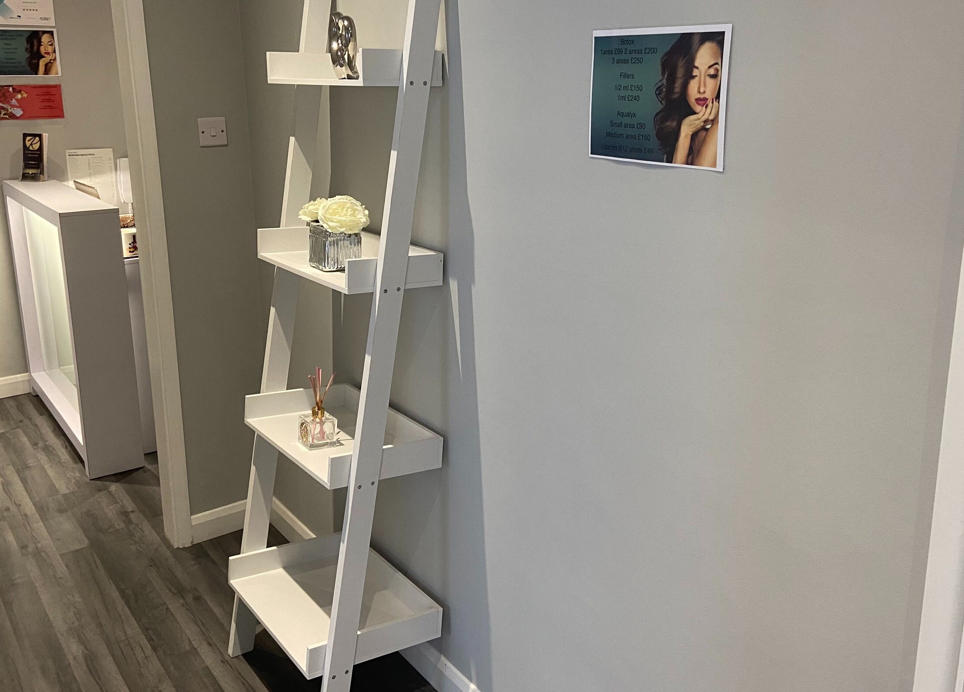 Modern interior at Revive Laser Clinic, Snodland, England, with sleek decor and skincare promotions displayed.