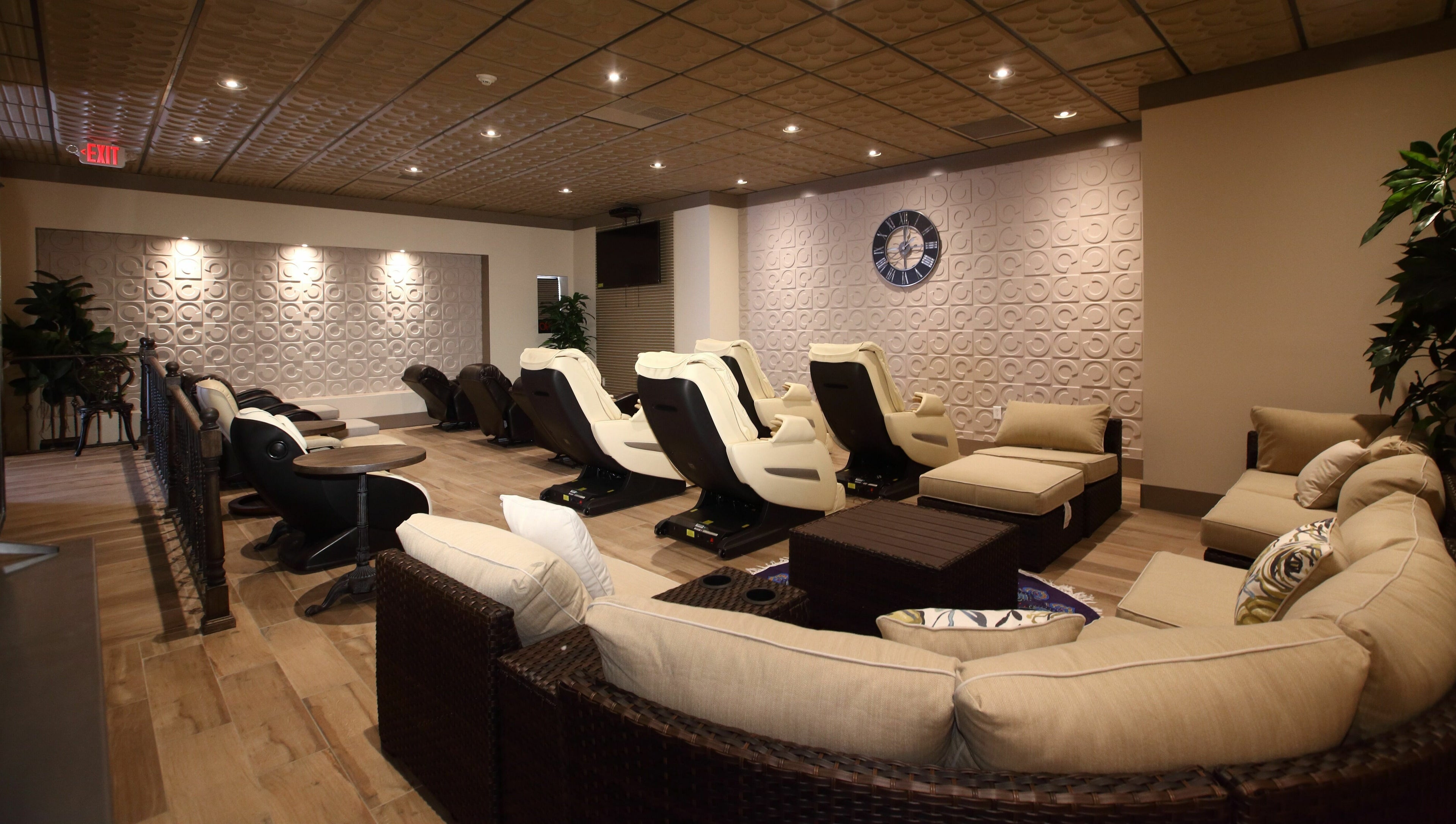 Comfortable spa seating in Aria Spa, Butler, New Jersey, US, with plush chairs and cozy decor.