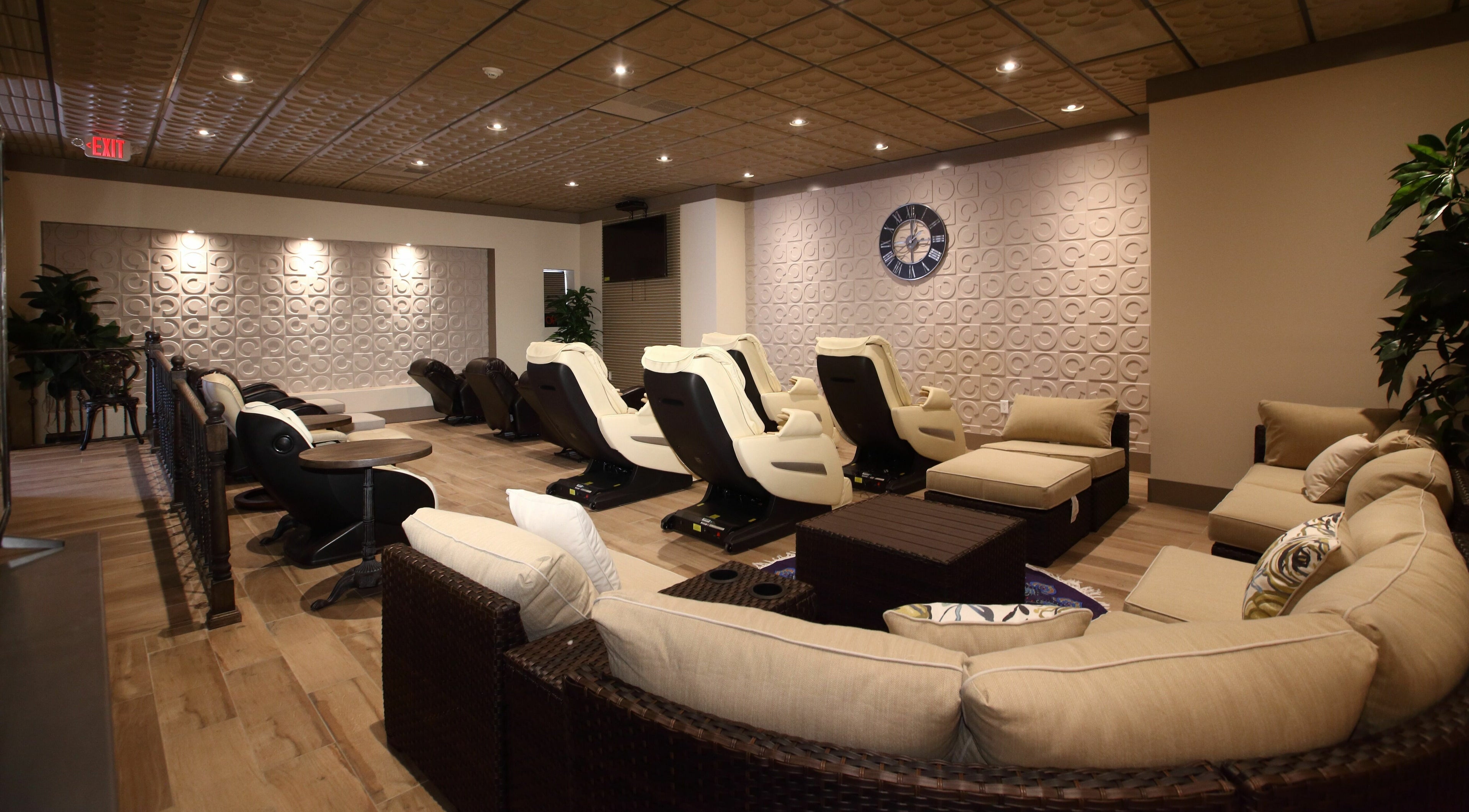 Comfortable spa seating in Aria Spa, Butler, New Jersey, US, with plush chairs and cozy decor.