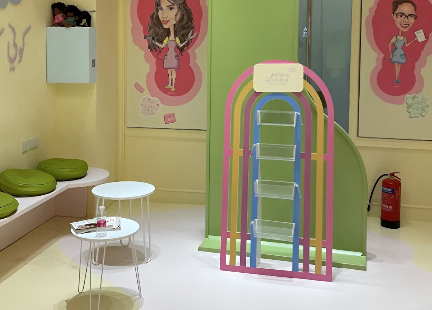 ManeandNatural | كيرلي بوتيك - Riyadh Branch seating area with green cushions and colorful decor. Riyadh, SA.