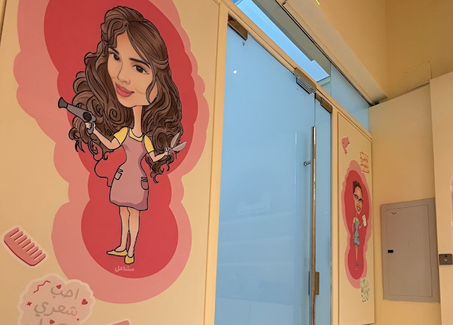Bright wall art at ManeandNatural | كيرلي بوتيك - Riyadh Branch, featuring a curly-haired caricature. Riyadh, SA.