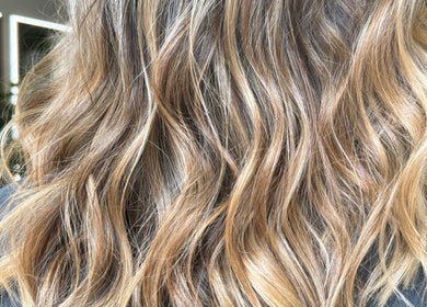 Close-up of wavy blond hair styled at Hair by Florie, Surry Hills, New South Wales, AU.