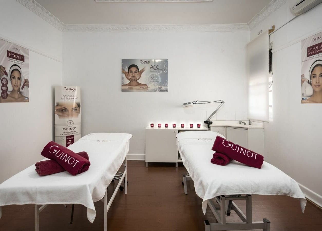 Tranquil treatment room at Beauty Nirvana, Melbourne, Victoria, AU, featuring two treatment beds and ambient lighting.