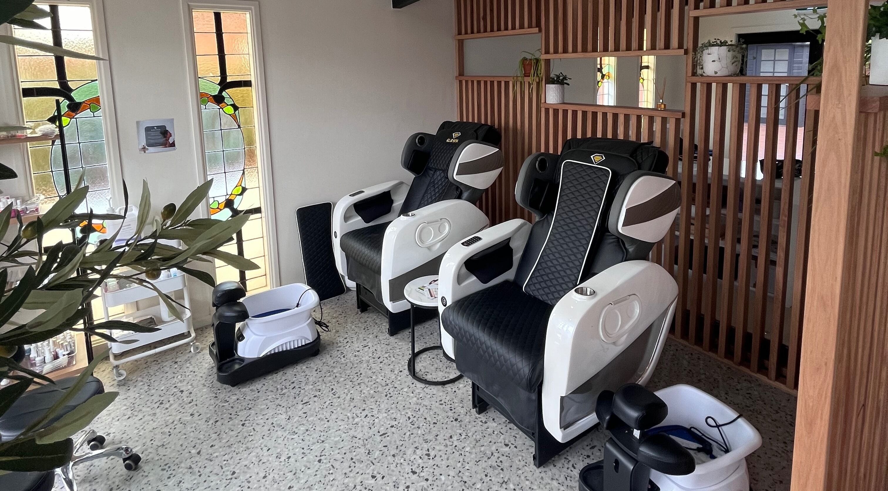 Relaxing lounge chairs at Kindred Beauty Lounge, Parkes, New South Wales, AU for a rejuvenating spa experience.