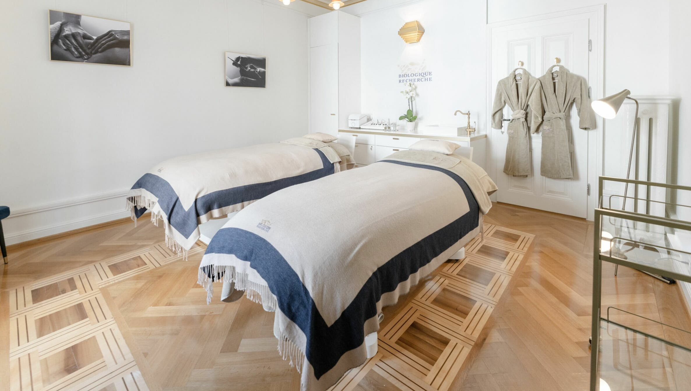 Elegant treatment room at Ambassade Biologique Recherche Zürich, featuring twin beds and robes, in Zürich, Zürich, CH.