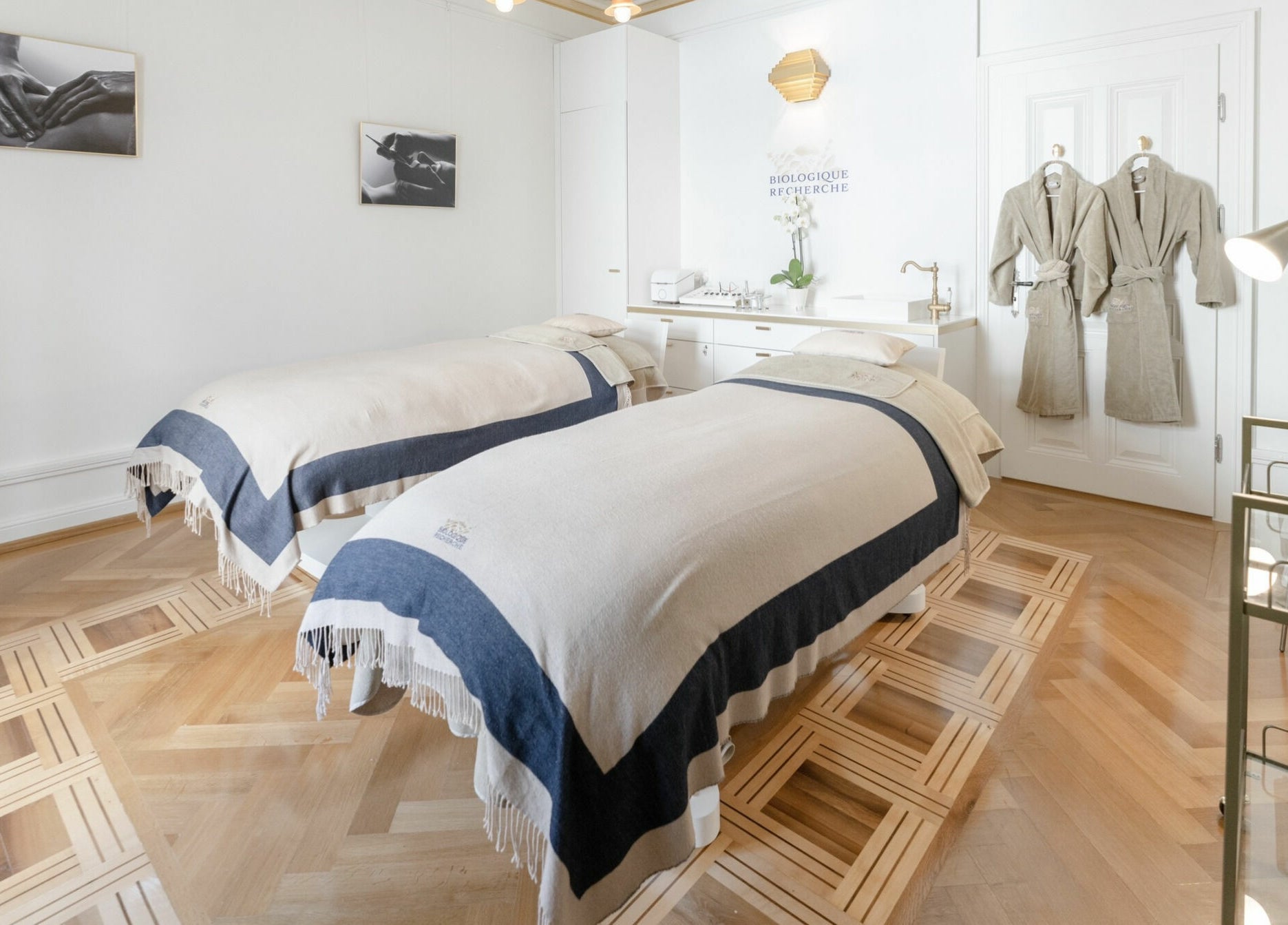 Elegant treatment room at Ambassade Biologique Recherche Zürich, featuring twin beds and robes, in Zürich, Zürich, CH.