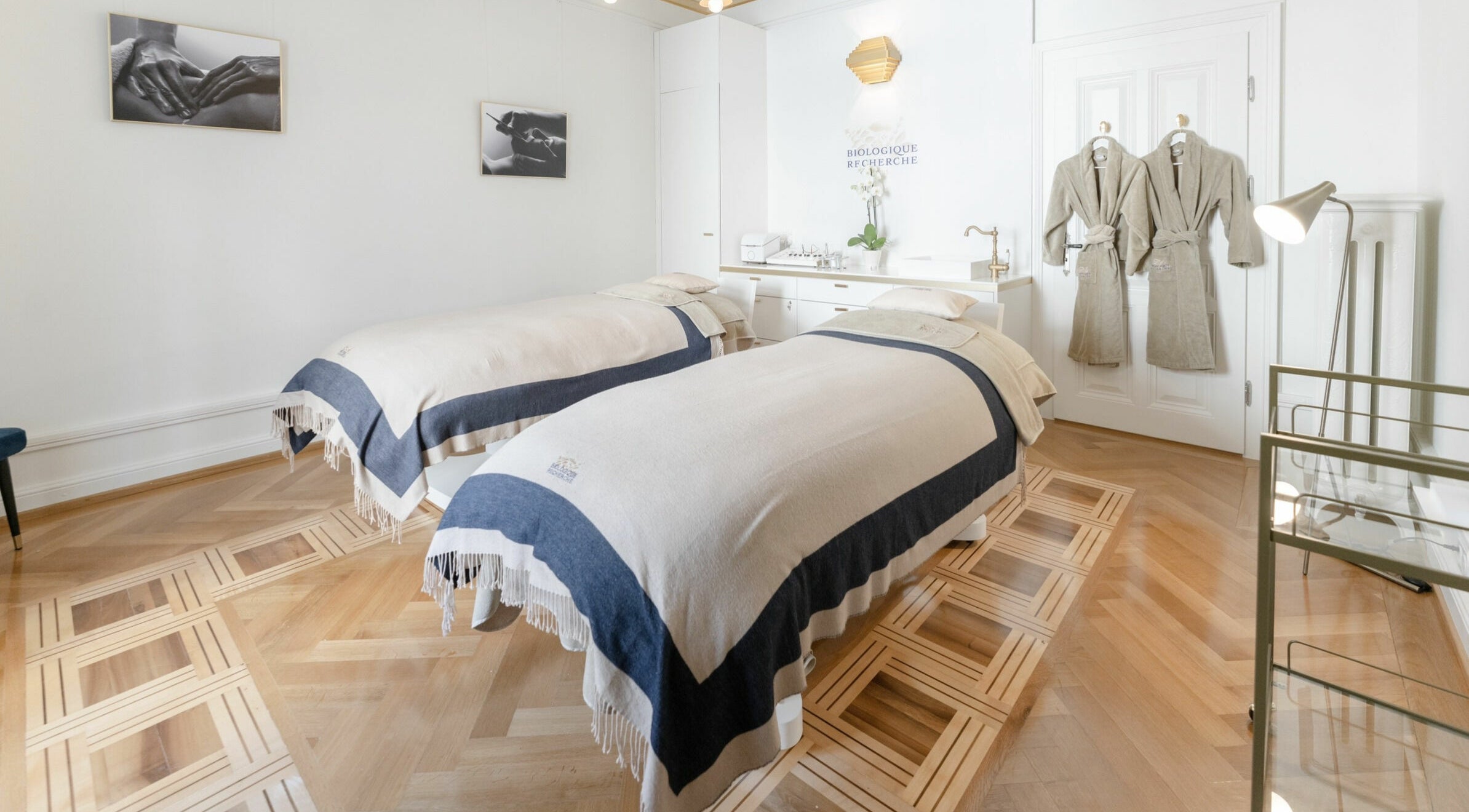 Elegant treatment room at Ambassade Biologique Recherche Zürich, featuring twin beds and robes, in Zürich, Zürich, CH.