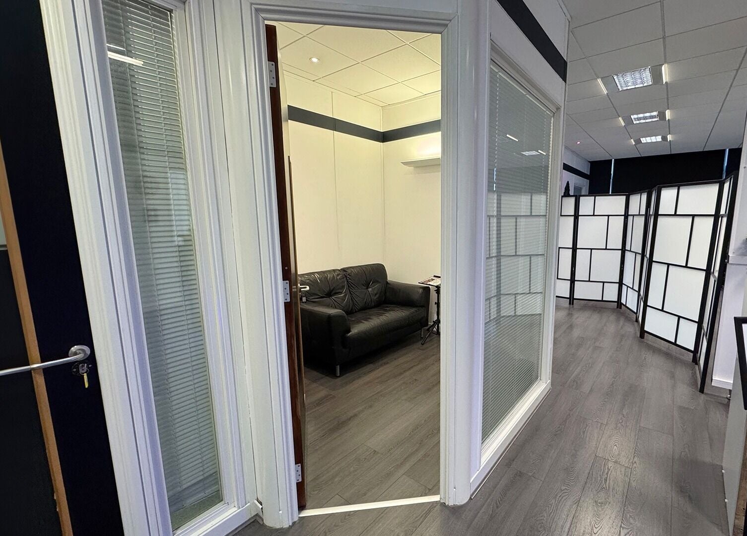 Interior view of Valhalla Tattoo Studio in Kilmarnock, Scotland, GB showing a welcoming lounge area.