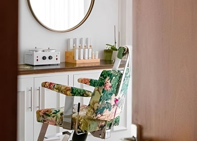 EDDA Studio beauty room with a floral chair and elegant decor in Chipping Norton, England, GB.