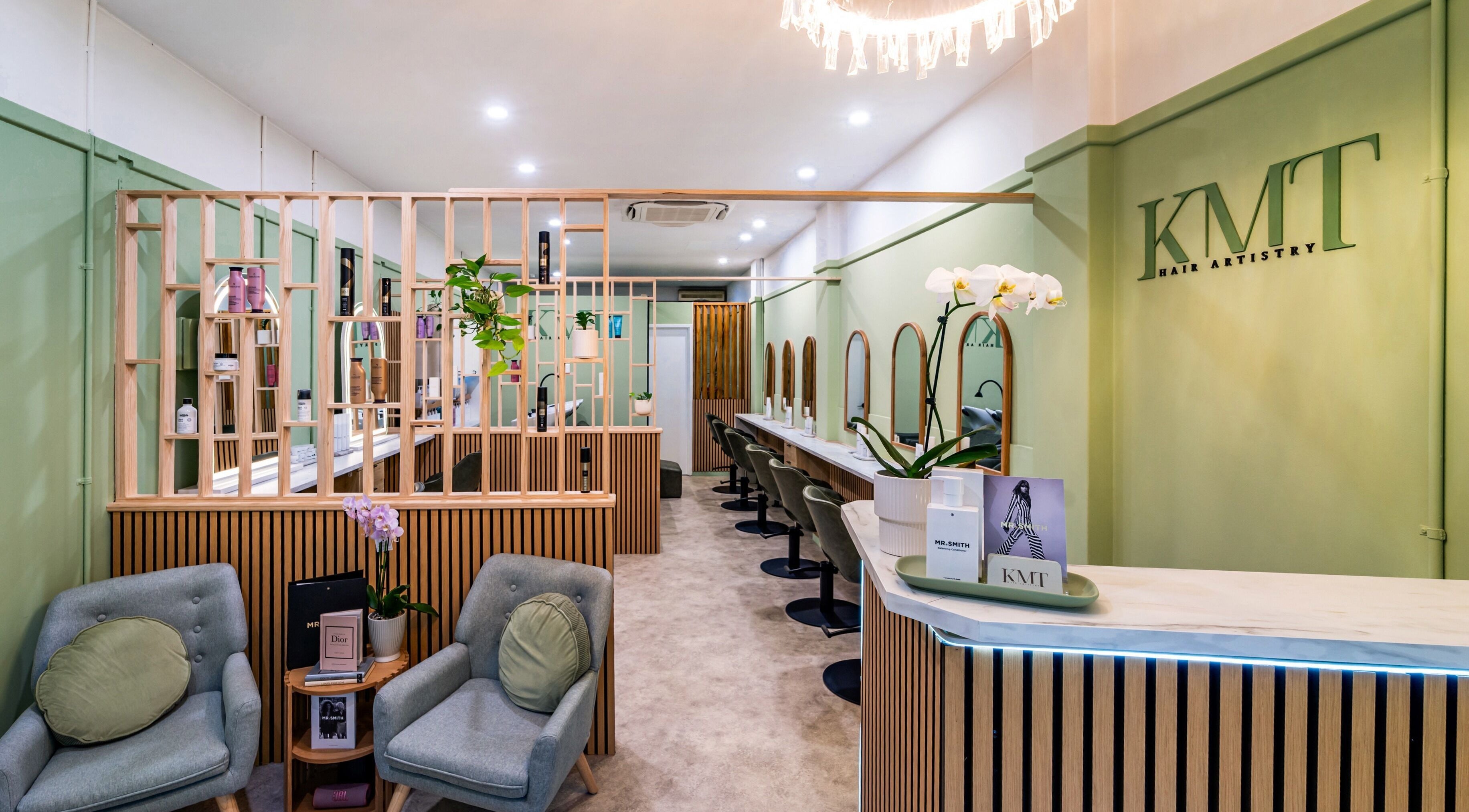 Interior of KMT Hair Artistry in Craigie, Western Australia, AU featuring modern decor and styling stations.