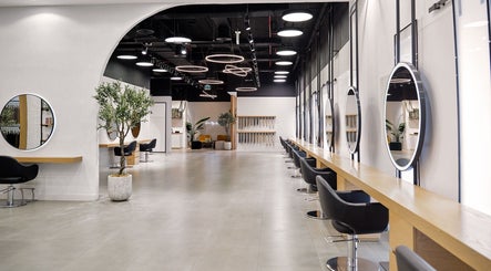 Spacious interior of Nicolas Beauty Salon FZ - LLC in Dubai, Dubai, AE featuring modern design and elegant mirrors.