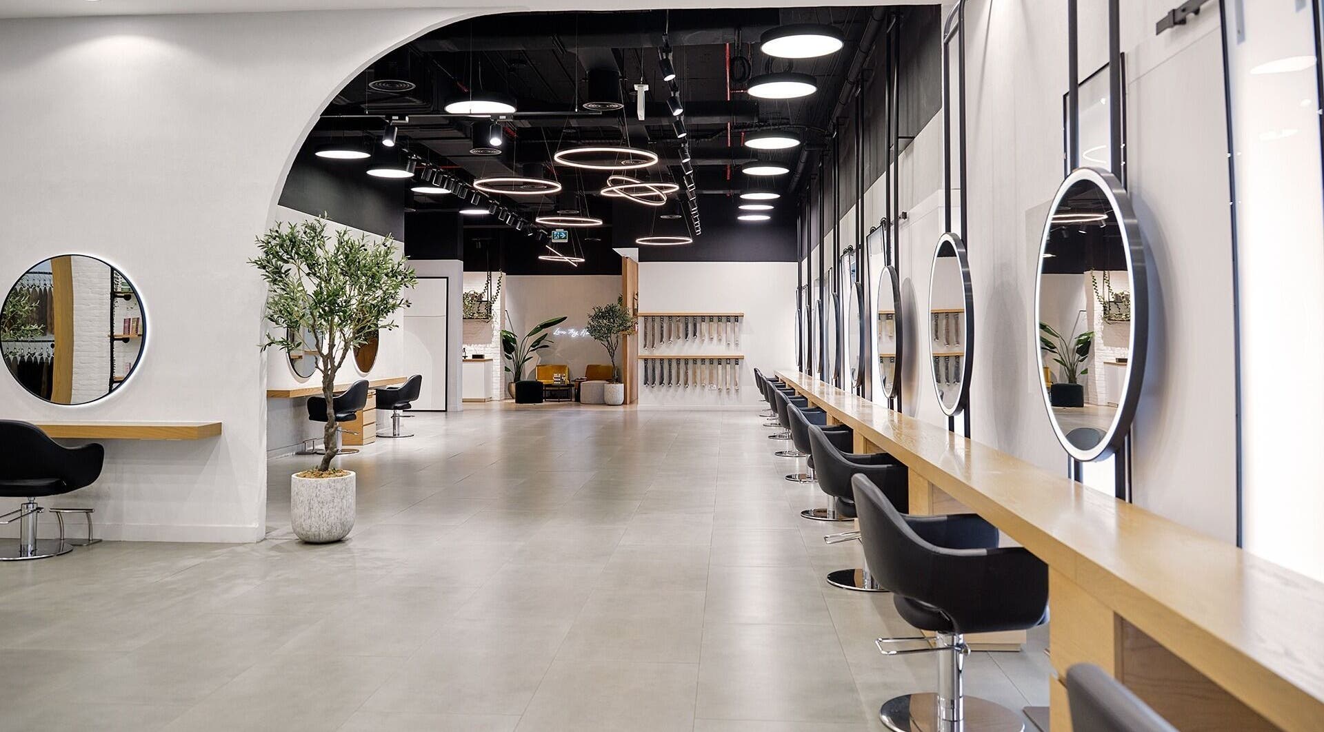 Spacious interior of Nicolas Beauty Salon FZ - LLC in Dubai, Dubai, AE featuring modern design and elegant mirrors.