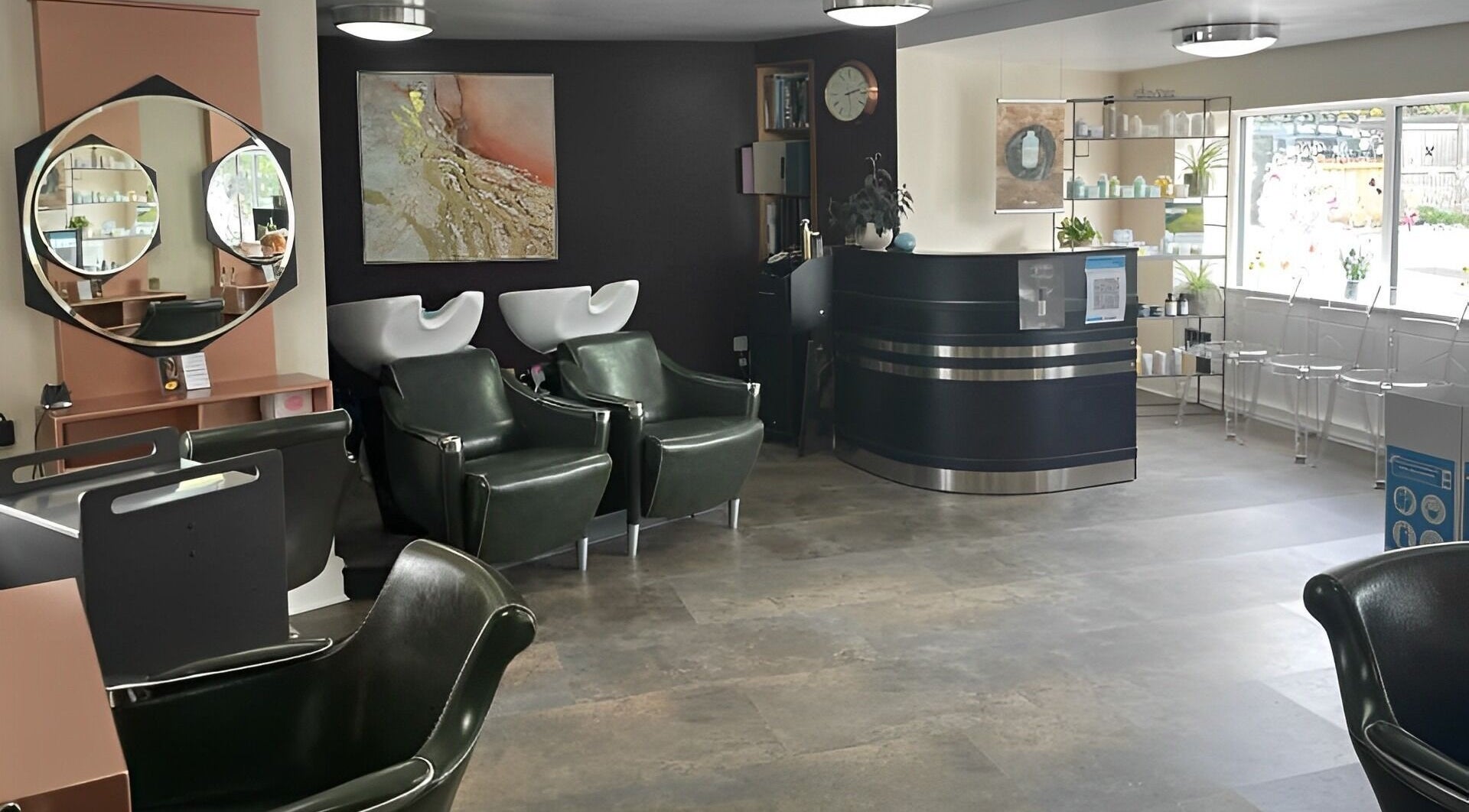 Chic interior of Avenue Hairdo Hair and Beauty featuring modern chairs and art in Crickhowell, Wales, GB.