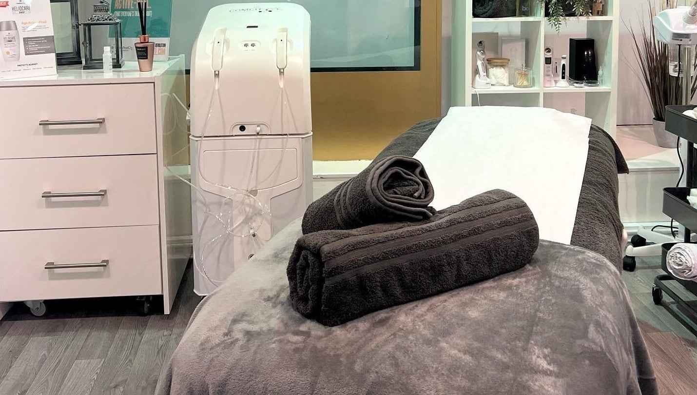 Cozy treatment room at RSB Aesthetics, Blackburn, England, GB featuring a massage bed with plush towels.
