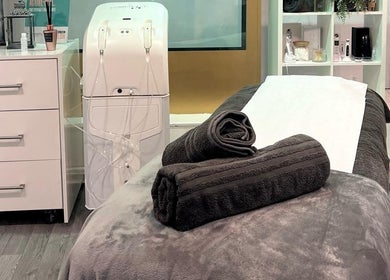 Cozy treatment room at RSB Aesthetics, Blackburn, England, GB featuring a massage bed with plush towels.