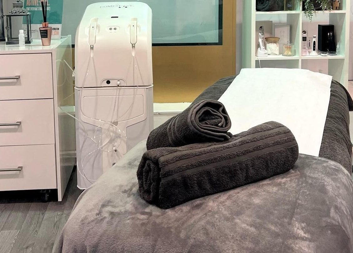 Cozy treatment room at RSB Aesthetics, Blackburn, England, GB featuring a massage bed with plush towels.