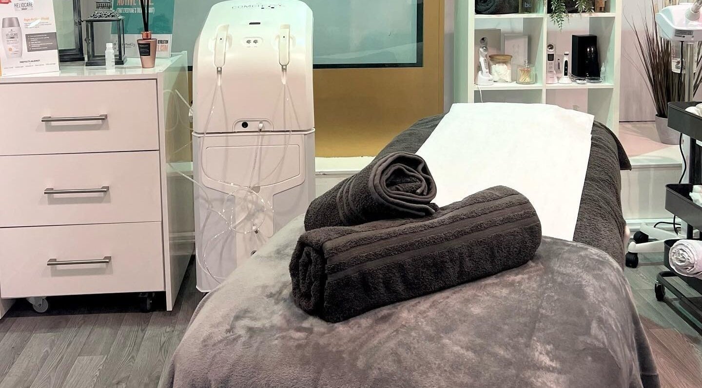 Cozy treatment room at RSB Aesthetics, Blackburn, England, GB featuring a massage bed with plush towels.