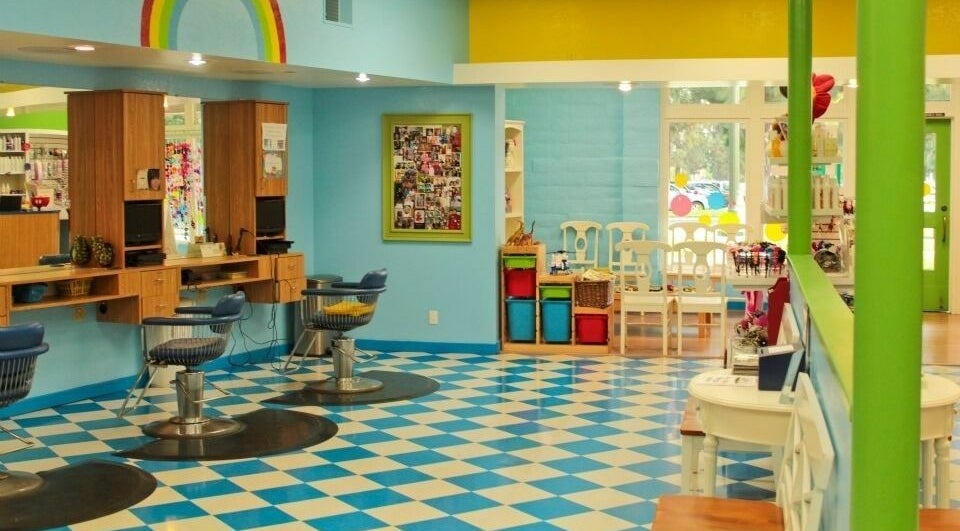 Rainbow Kids Hairstyling YL in Yorba Linda, California, features colorful, playful decor with child-friendly styling chairs.