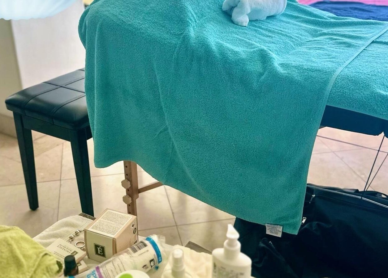 Serenity and Bliss Mobile Massage Barbados setup in Saint Michael, featuring a massage table and products.