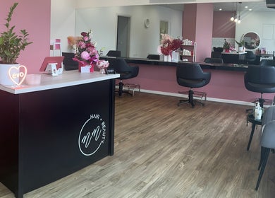 Elegant salon interior at The Rosy Blonde, Melbourne, Victoria, AU with stylish chairs and modern decor.