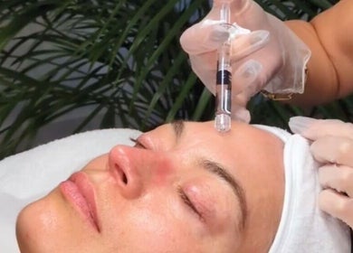 Aesthetic treatment at Ellia | Advanced Aesthetics, Skin, SPMU, Orpington, England, GB. Expert using syringe.