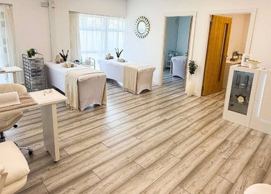 Spacious, serene treatment room at Natalie's Beauty & Training, Cardiff, Wales, GB, with elegant decor.