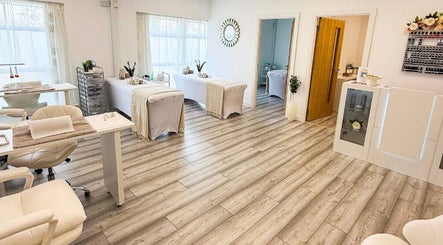 Spacious, serene treatment room at Natalie's Beauty & Training, Cardiff, Wales, GB, with elegant decor.