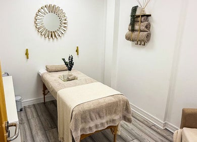 Relaxing spa room at Natalies Beauty & Training, Cardiff, Wales, GB with calming decor and massage table.