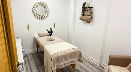 Relaxing spa room at Natalies Beauty & Training, Cardiff, Wales, GB with calming decor and massage table.