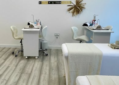 Interior of Natalies Beauty & Training in Cardiff, Wales, GB featuring treatment tables and manicure stations.