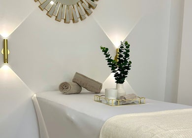 Elegant treatment room at Natalies Beauty & Training, Cardiff, Wales, GB, showcasing plush towels and calming decor.