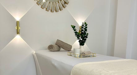 Relaxing massage table setup at Natalies Beauty & Training in Cardiff, Wales, GB, featuring elegant decor.