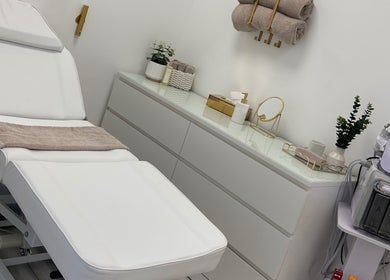 Relaxing spa room at Natalies Beauty & Training in Cardiff, Wales, GB featuring a treatment bed and beauty equipment.