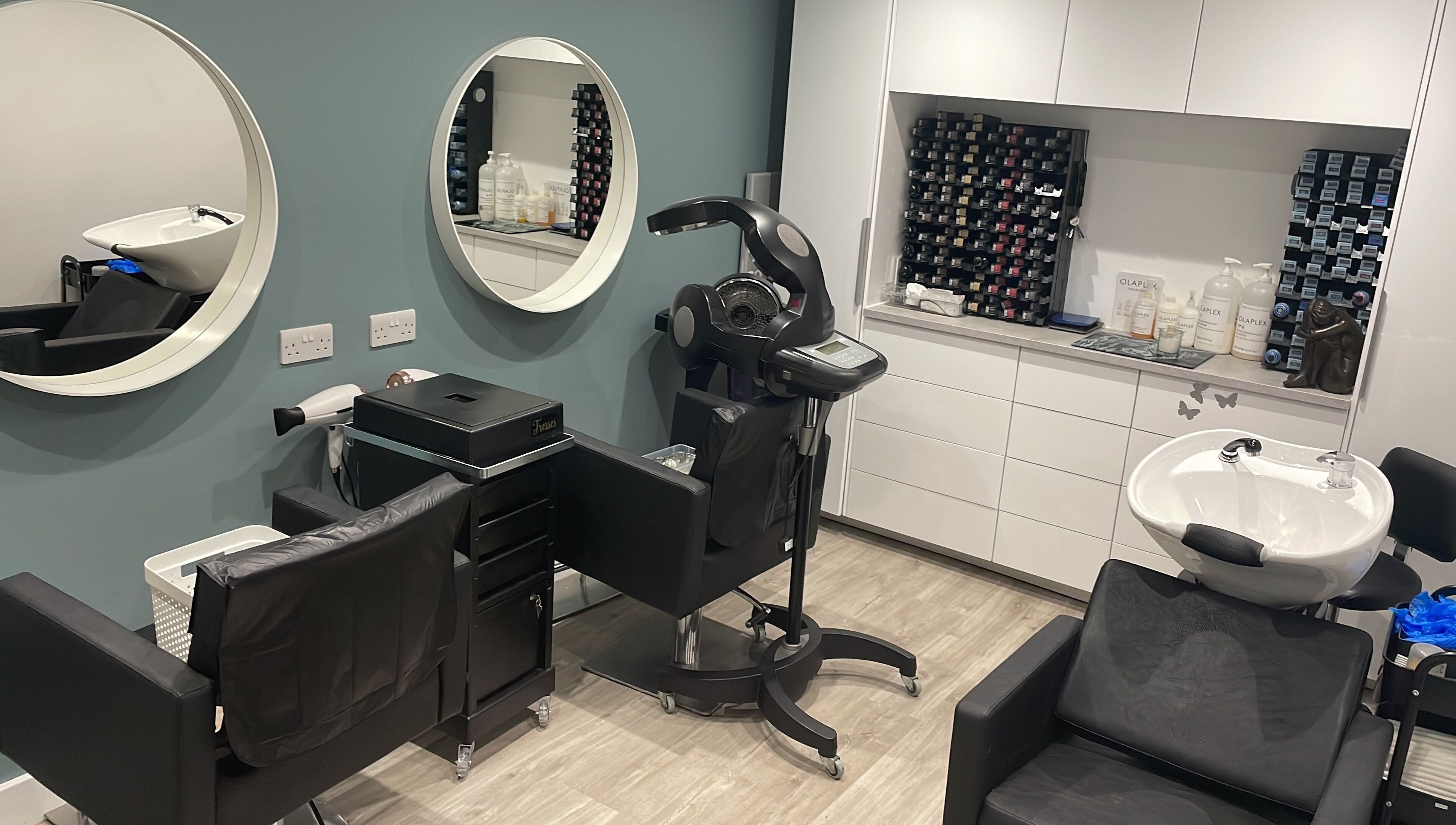 Modern styling station at Tresses Colour & Styling Room in Rochford, England, GB with elegant design and hair products.