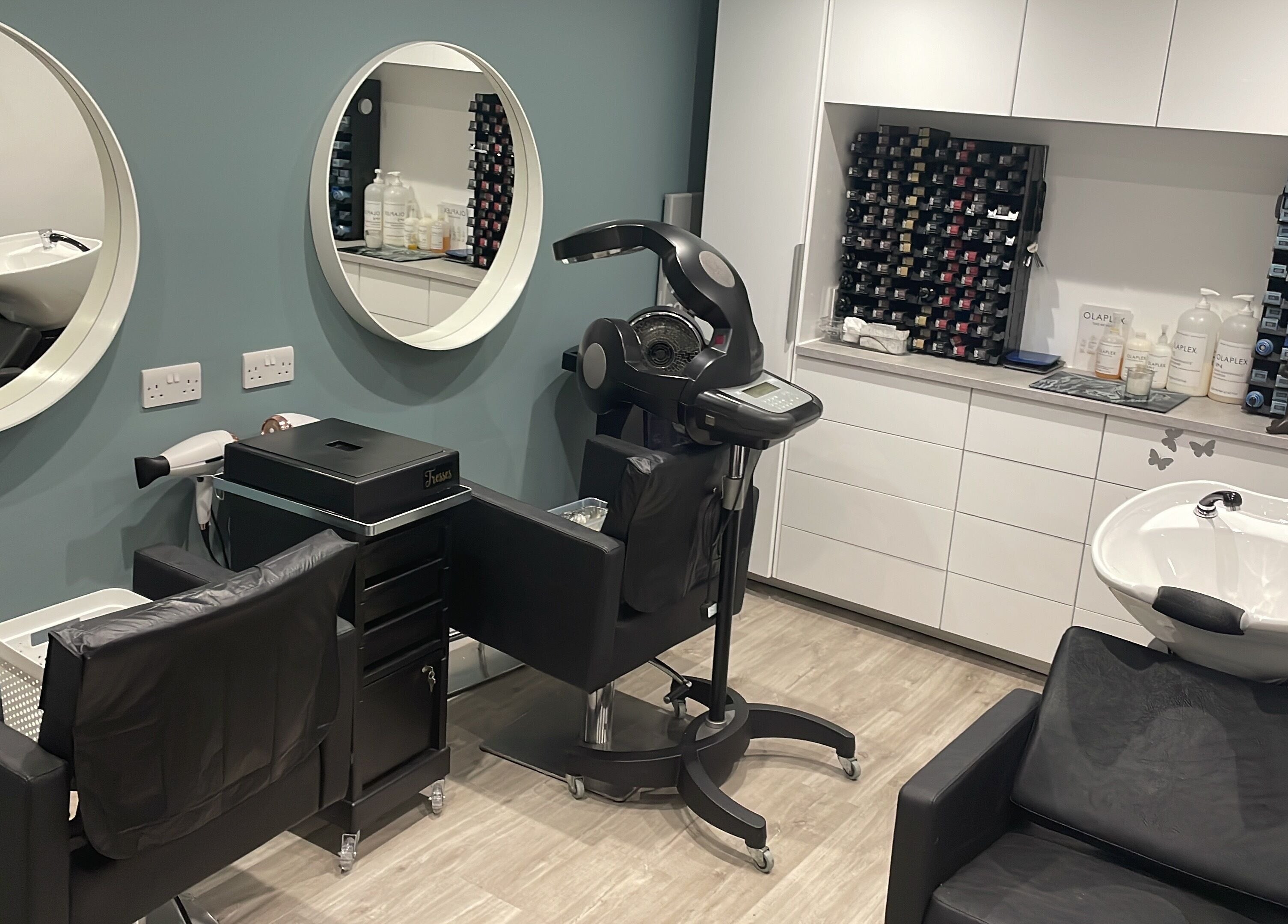 Modern styling station at Tresses Colour & Styling Room in Rochford, England, GB with elegant design and hair products.